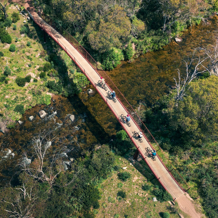 A family enjoys a bicycle ride along the Thredbo Valley Track, Snowy Mountains