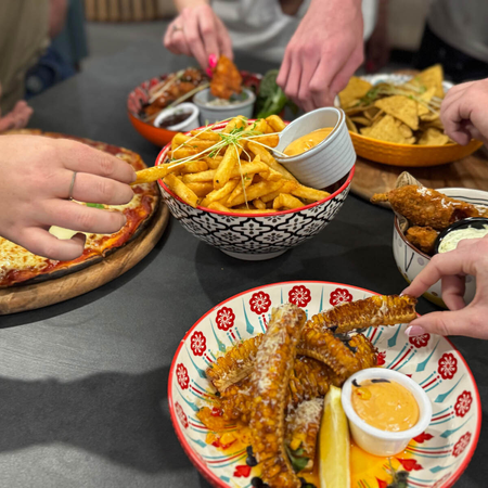 Patrons sharing Mexican-inspired dishes at The Mad Mexican Batemans Bay.
