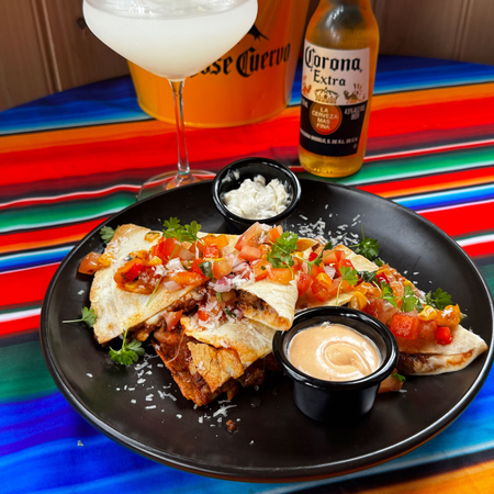 Mexican enchiladas with dipping sauces at The Mad Mexican Batemans Bay.