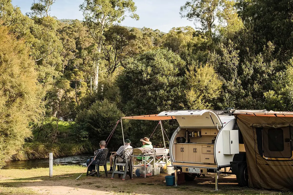 Powered camping and caravan sites nestled among trees and right on the Yarra River at Warburton Holiday Park, Warburton.