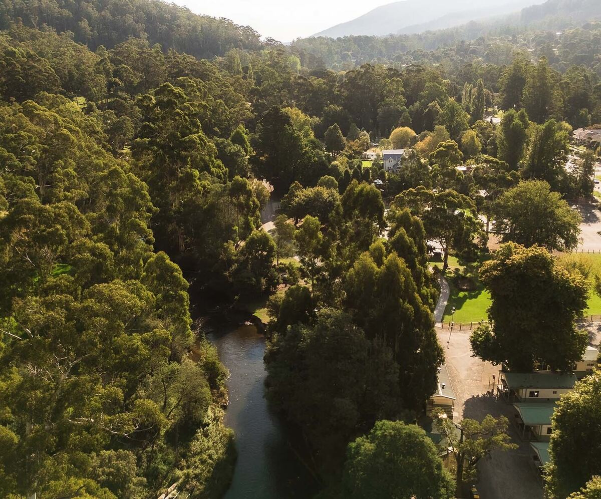 Aerial view of accommodation and camping areas and the Yarra River at Warburton Holiday Park in Warburton, Yarra Valley.