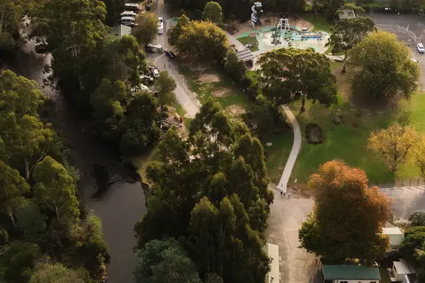 Aerial view of accommodation and camping areas and the Yarra River at Warburton Holiday Park in Warburton, Yarra Valley.