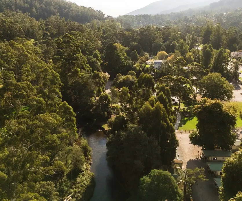 Aerial view of accommodation and camping areas and the Yarra River at Warburton Holiday Park in Warburton, Yarra Valley.