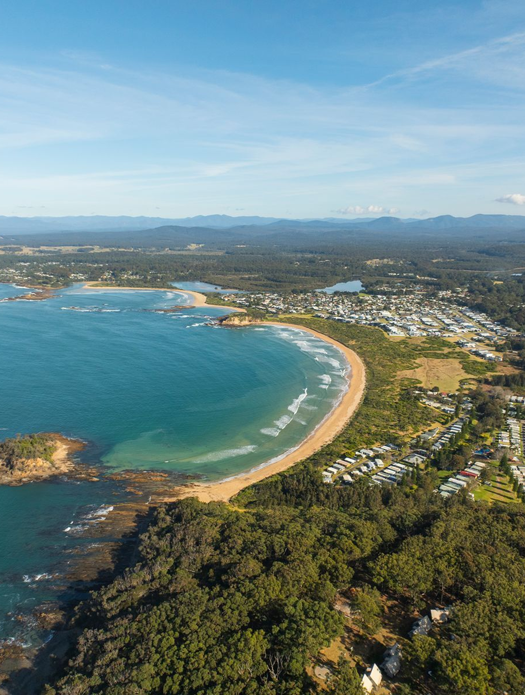 Aerial view of Barlings Beach caravan park and the Tomakin coastline