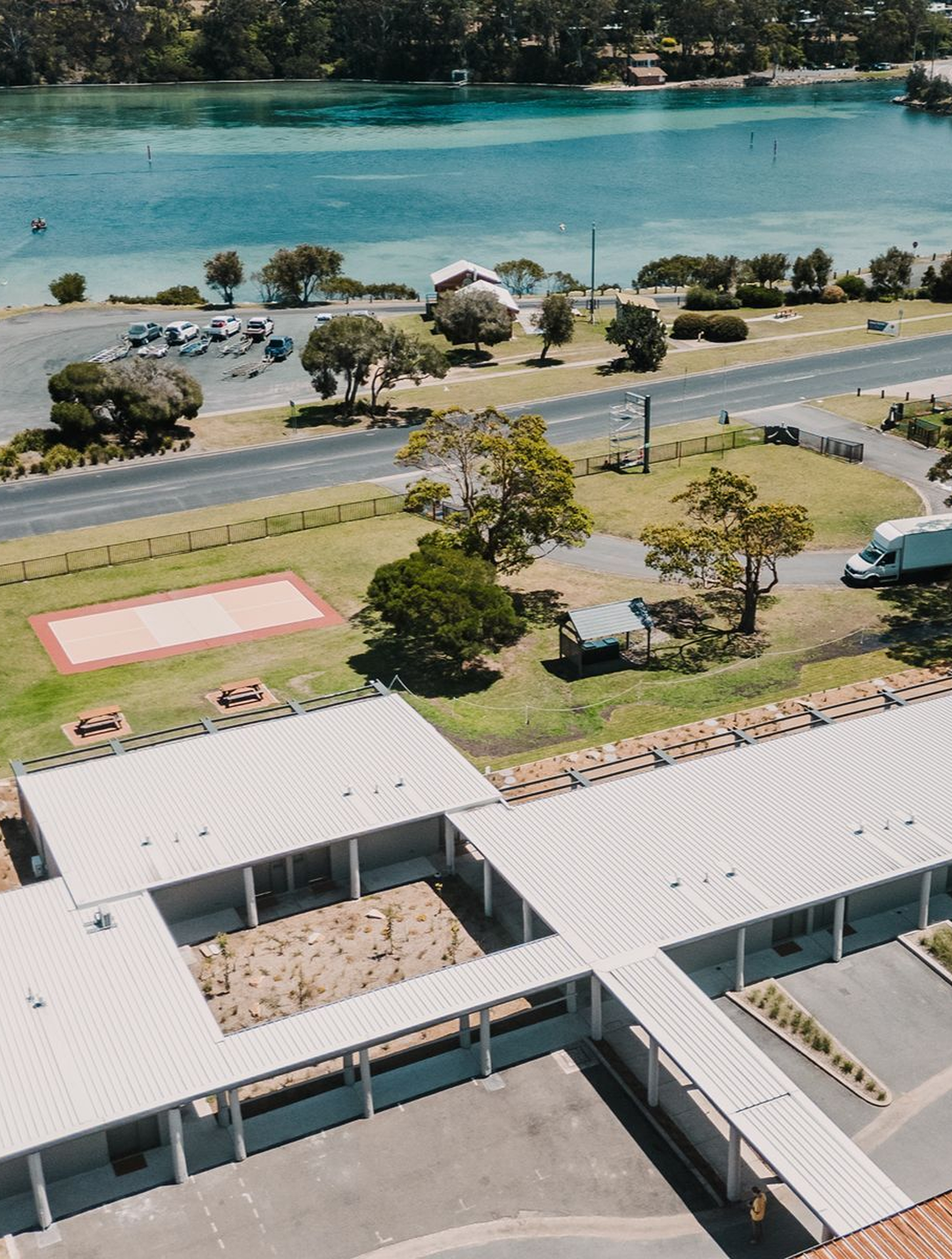 Black Dolphin Motel Merimbula: aerial view of the motel's distinctive architecture and location beside Merimbula Lake