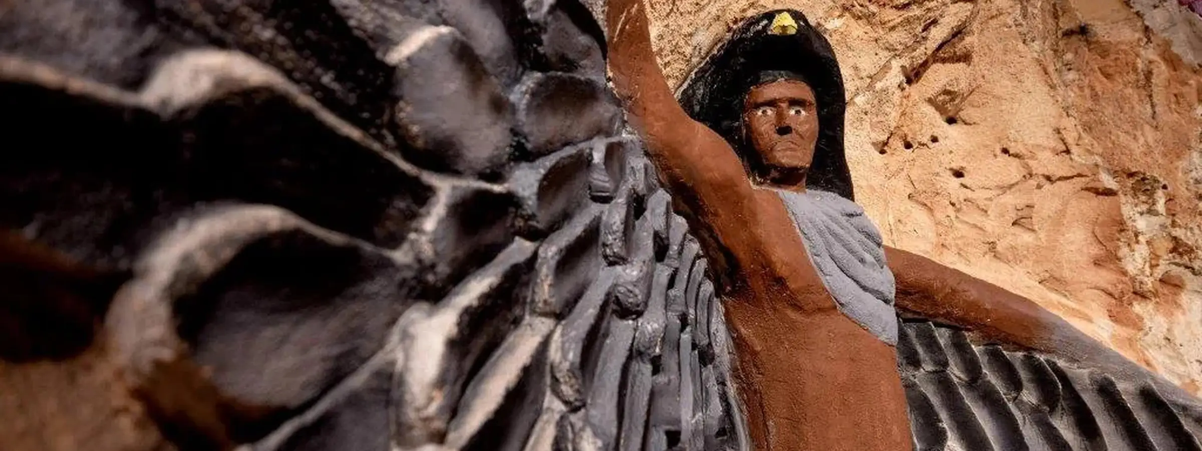 Detailed underground sandstone carvings at the Chambers of the Black Hand, Lightning Ridge