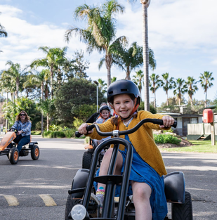 Children riding pedal karts at Barlings Beach Holiday Park