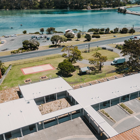 Black Dolphin Motel Merimbula: aerial view of the motel's distinctive architecture and location beside Merimbula Lake