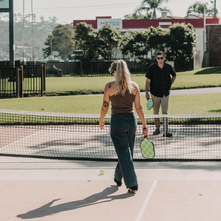 Merimbula holiday park: guests enjoying the pickleball courts at Black Dolphin Holiday Park